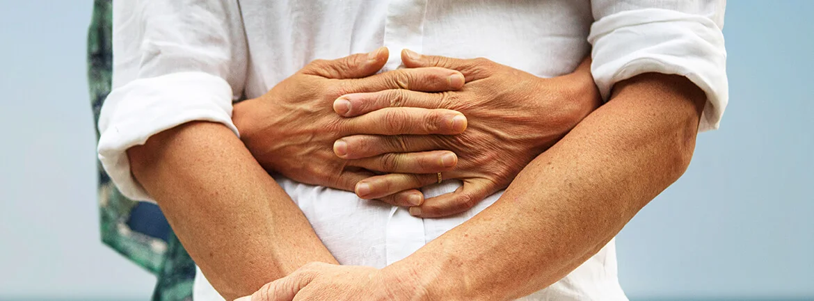a close-up of a man holding his hands together