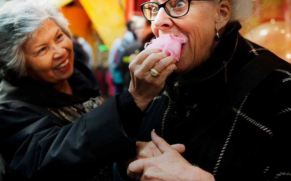 two women eating candyfloss