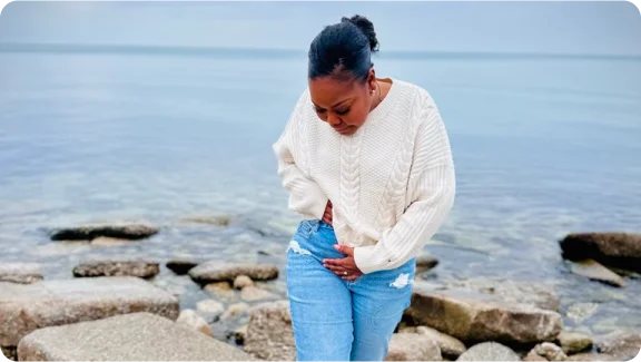 Renee standing on the beach