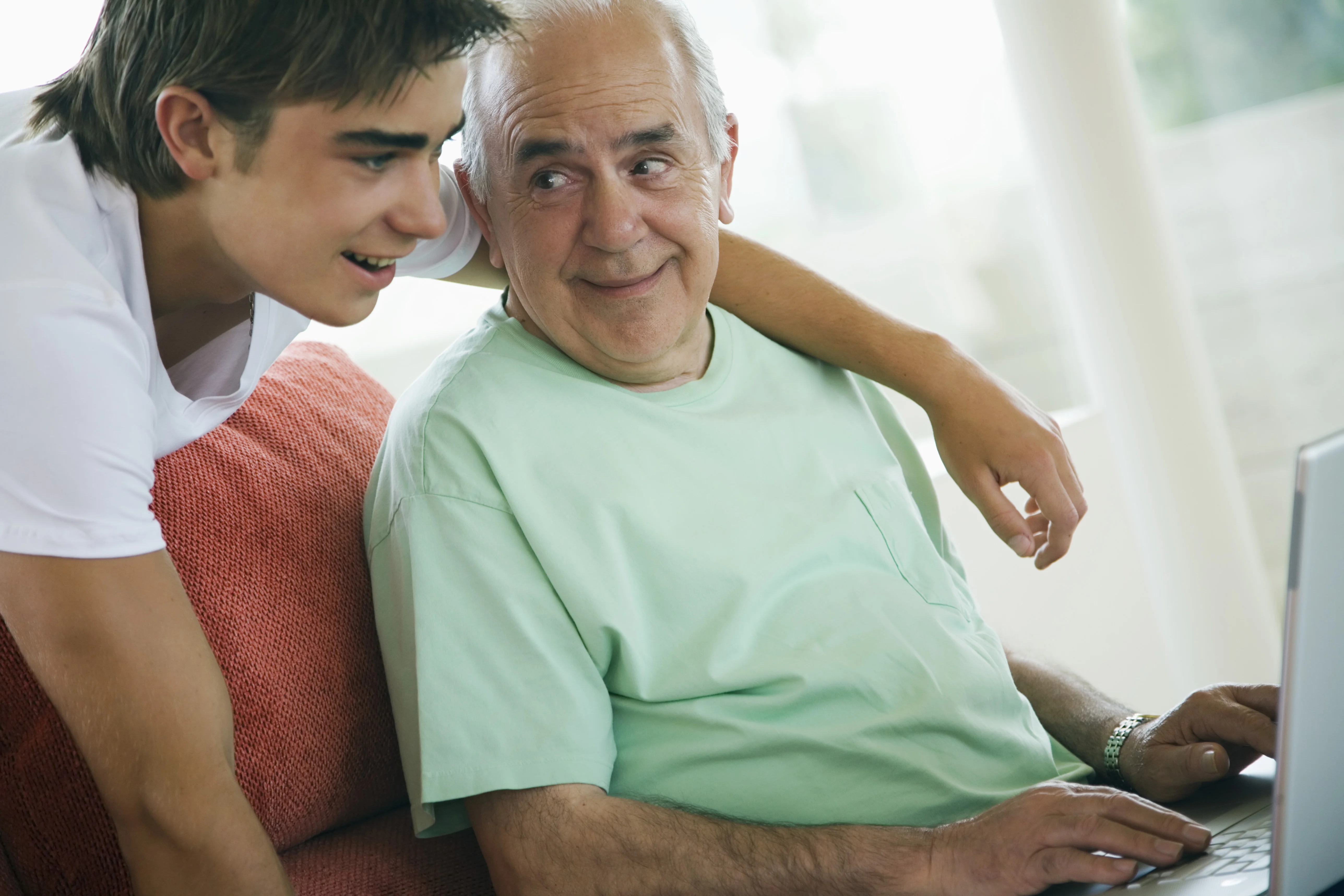 two men looking at a computer screen