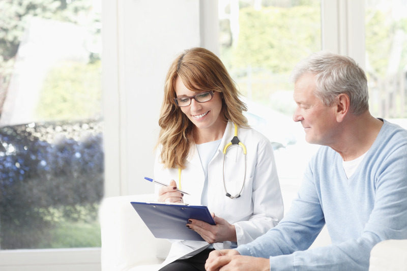 a female HCP talking to male patient